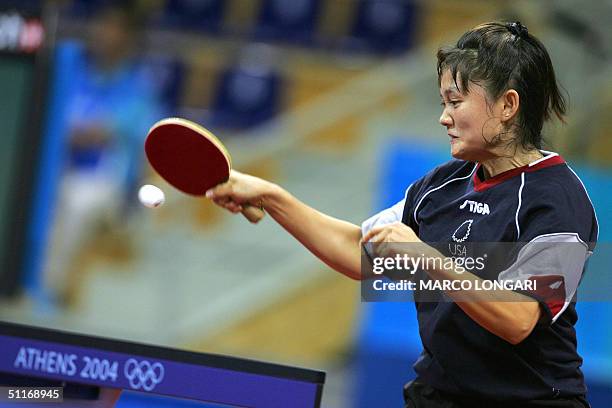 Tawny Banh of the US grimaces while returning a shot against Yoon Ji-Hye on South Korea in their women's singles first round match at the Olympic...