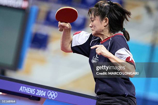South Korean Yoon Ji-Hye grimaces while returning a shot against Tawny Banh of the US in their women's singles first round match at the Olympic Games...