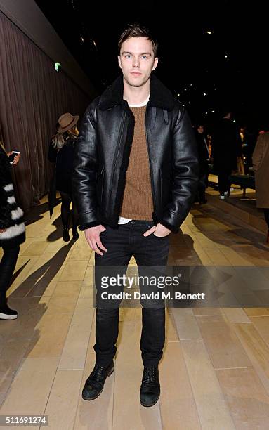 Nicholas Hoult wearing Burberry at the Burberry Womenswear February 2016 Show at Kensington Gardens on February 22, 2016 in London, England.