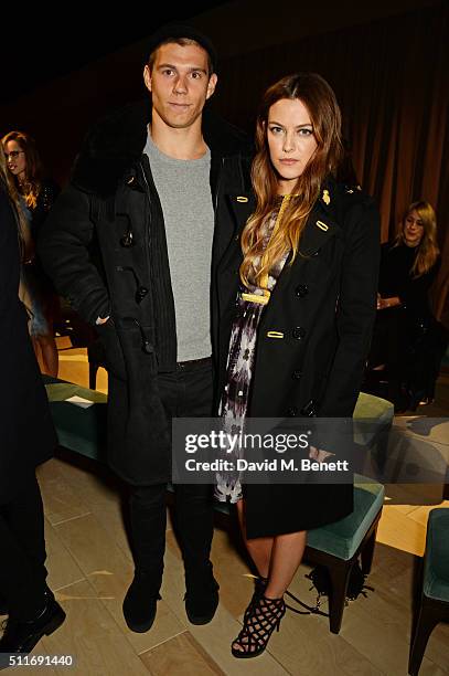 Ben Smith-Petersen and Riley Keough wearing Burberry at the Burberry Womenswear February 2016 Show at Kensington Gardens on February 22, 2016 in...