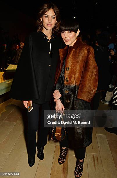 Alexa Chung and Noomi Rapace wearing Burberry at the Burberry Womenswear February 2016 Show at Kensington Gardens on February 22, 2016 in London,...