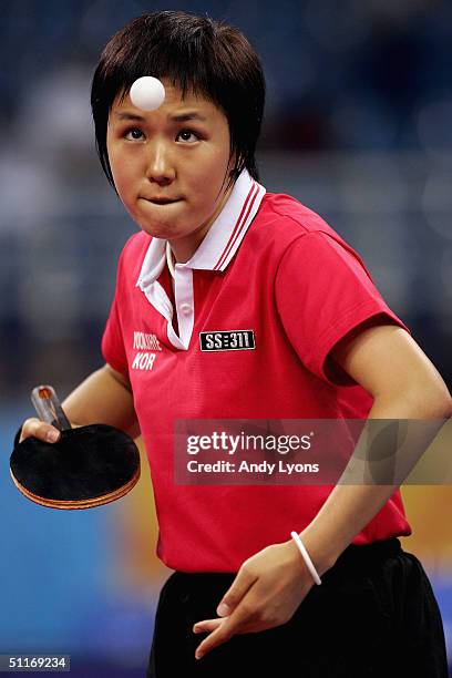 Ji Hye Yoon of Korea hits a serve against Tawny Banh of the United States of America during the women's singles table tennis match on August 14, 2004...