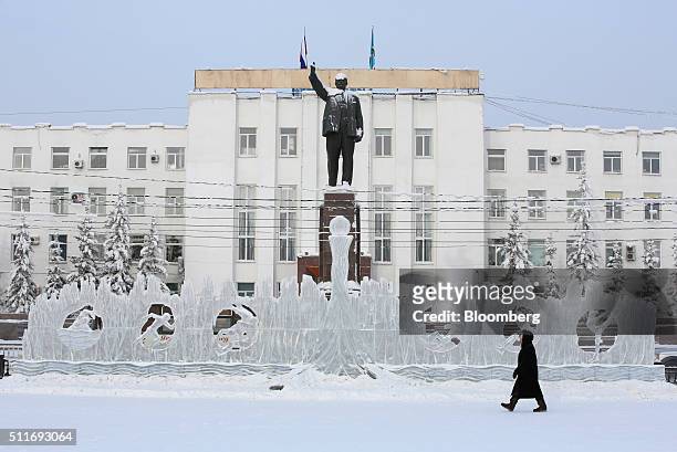 Statue of Vladimir Lenin stands above an ice sculpture on Lenin Square in Yakutsk, Sakha Republic, Russia, on Sunday, Feb. 14, 2016. Yakutsk, the...
