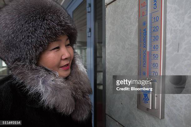 Visitor dressed in furs reads a daytime temperature of -41 degrees centigrade on a thermometer outside the Tygn Darkhan hotel in Yakutsk, Sakha...