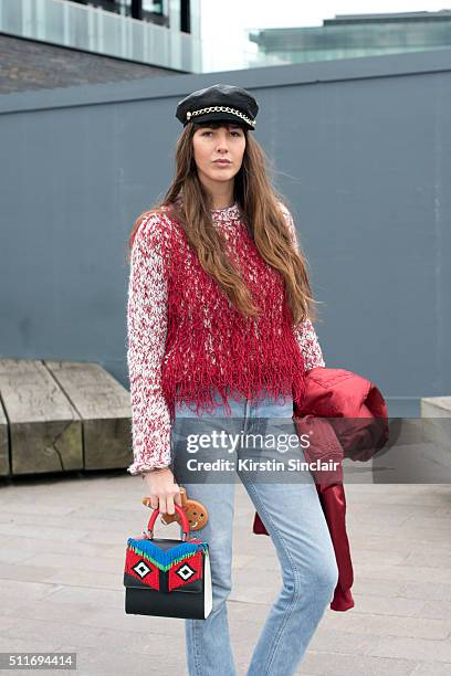 Fashion stylist Estelle Pigault wears a Pretty Little Thing jacket, Leviâs jeans, Eugenia Kim hat, Gayeon Lee top and Les Petites Jouers bag on day 3...