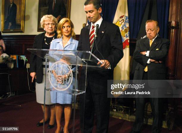 New Jersey Governor James McGreevey addresses the medeia with his wife Dina at his side where he admitted to being gay and to having an extramarital...