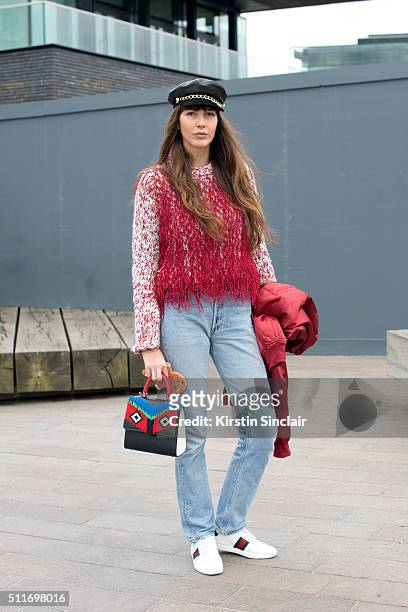 Fashion stylist Estelle Pigault wears a Pretty Little Thing jacket, Leviâs jeans, Eugenia Kim hat, Gayeon Lee top, Les Petites Jouers bag and Gucci...