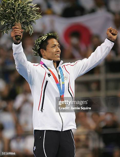 Tadahiro Nomura of Japan celebrates winning the gold medal in the men's judo -60 kg class event on August 14, 2004 during the Athens 2004 Summer...