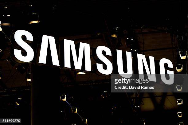 Logo sits illuminated outside the Samsung pavilion on the opening day of the World Mobile Congress at the Fira Gran Via Complex on February 22, 2016...