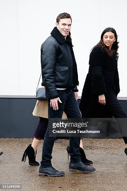 Nicholas Hoult attends the Burberry Womenswear show during London Fashion Week Autumn/Winter 2016/17 at on February 22, 2016 in London, England.