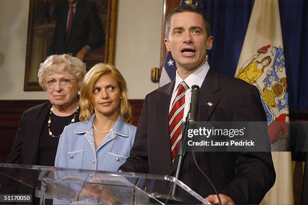 New Jersey Governor James McGreevey addresses the medeia with his wife Dina at his side where he admitted to being gay and to having an extramarital...