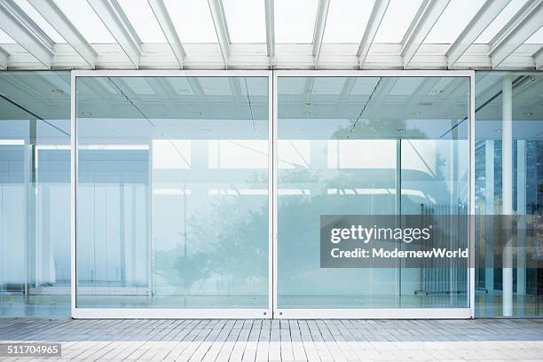 reflection in the large window - vidro imagens e fotografias de stock