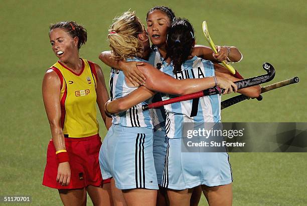 Alejandra Laura Gulla, Vanina Paula Oneto and Agustina Soledad Garcia of Argentina celebrate victory in front of Silvia Munoz of Spain in the women's...