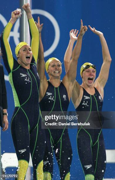 Petria Thomas, Lisbeth Lenton, Alice Mills of Australia celebrate victory n the women's 4 x 100 metre freestyle relay final on August 14, 2004 during...