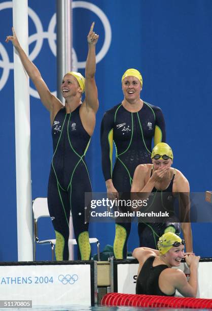 Lisbeth Lenton, Petria Thomas, Alice Mills and Jodie Henry of Australia celebrate victory n the women's 4 x 100 metre freestyle relay final on August...