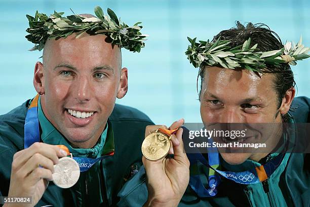 Grant Hackett and Ian Thorpe of Australian pose with their medals after the men's swimming 400 metre freestyle final on August 14, 2004 during the...