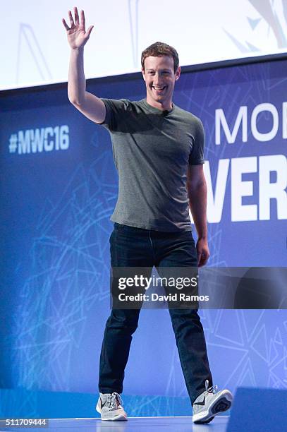 Founder and CEO of Facebook Mark Zuckerberg waves as he arrives for a keynote conference on the opening day of the World Mobile Congress at the Fira...