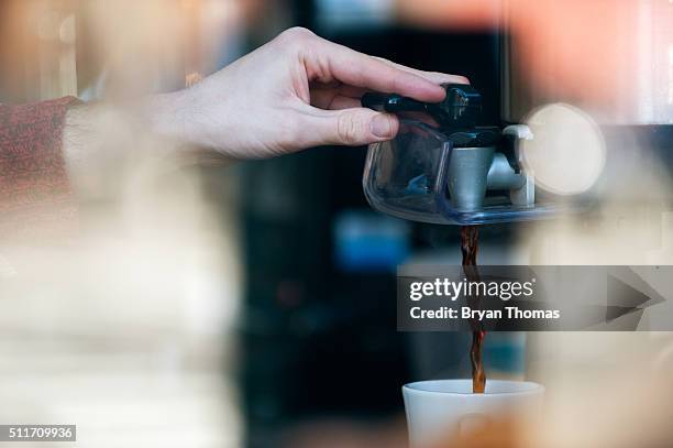 Barista pours a cup of coffee at Colson Patisserie on February 22, 2016 in the Brooklyn borough of New York City. A recently released study found...