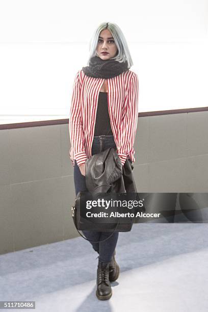 Alejandra Gomez wears Doctor Martens boots, Zara pants, Vintage shirt and Vintage top during Mercedes Benz Fashion Week at Ifema on February 19, 2016...
