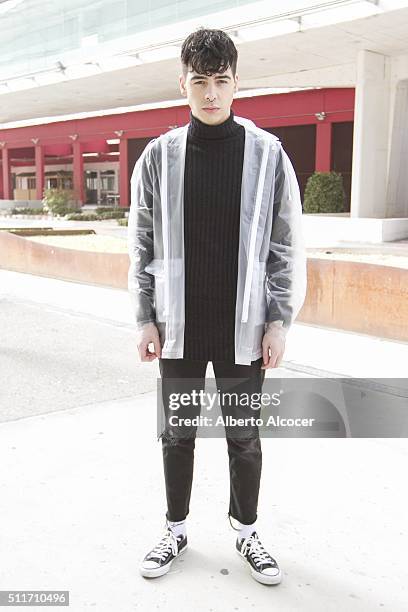 Angel Soto wears Converse shoes, Zara pants, Zara Jersey and Jani Richeli Jacket during Mercedes Benz Fashion Week at Ifema on February 19, 2016 in...