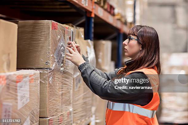 worker reading the barcode with the mobile phone app - phone scan stock pictures, royalty-free photos & images