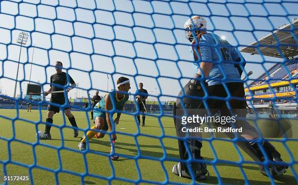 Jamie Dwyer of Australia scores one of his three goals in the second half against New Zealand during the men's field hockey preliminaries on August...