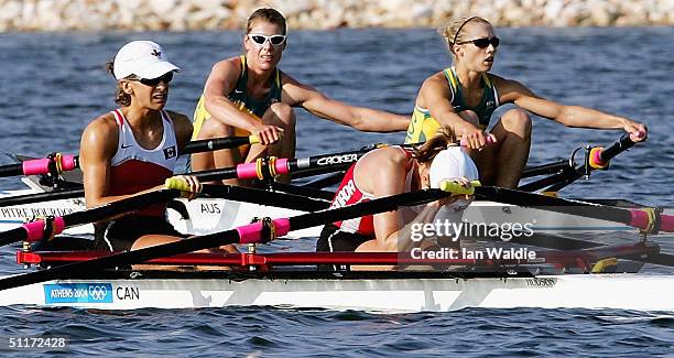 Sally Newmarch and Amber Halliday from Australia row past Mara Jones and Fiona Milne from Canada after competing in the women's lightweight double...