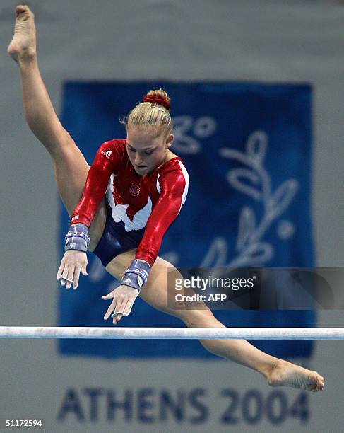 Annia Hatch of the US performs on the uneven bars during the Artistic Gymnastics qualifications, 15 August 2004 at the Olympic Indoor Hall during the...