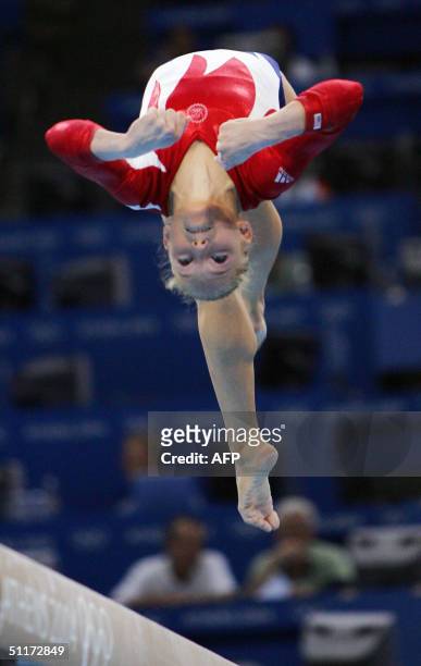 Courtney Mccool of the US performs on the beam during the Artistic Gymnastics qualifications, 15 August 2004 at the Olympic Indoor Hall during the...