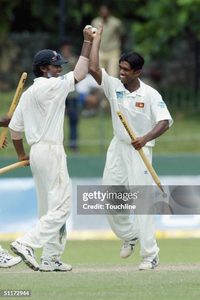 Lasith Malinga and Kumar Sangakkara of Sri Lanka celebrate victory during the 5th day of the Second Test between between Sri Lanka and South Africa...