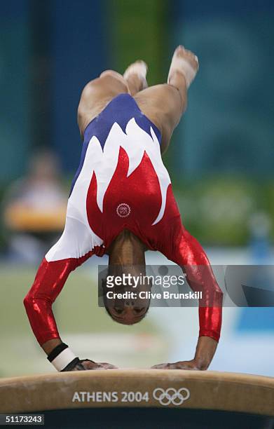 Annia Hatch of the USA competes in the qualification round of the team event at the women's artistic gymnastics competition on August 15, 2004 during...