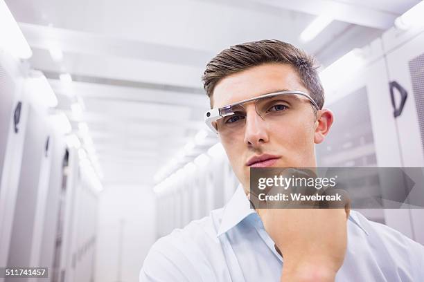 businessman standing in the server room - configuring stock pictures, royalty-free photos & images