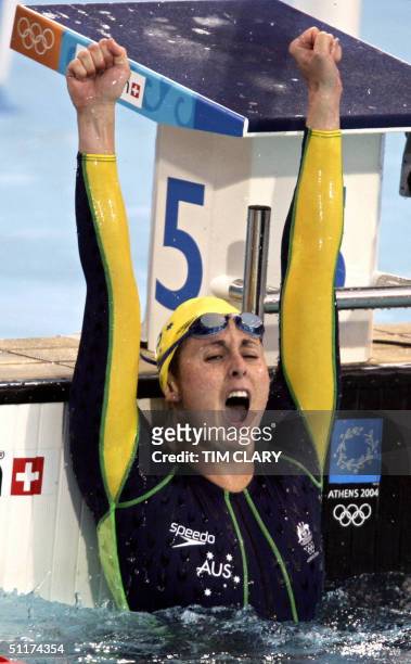Petria Thomas from Australia celebrates as she won the gold medal in the women's 100m butterfly final at the 2004 Olympic Games at the Olympic...
