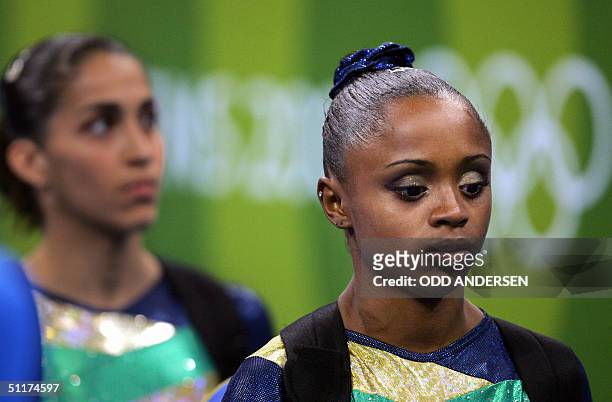 Daiane dos Santos concentrates before performing on the floor in the women's Artistic Gymnastics qualifications, 15 August 2004 at the Olympic Indoor...