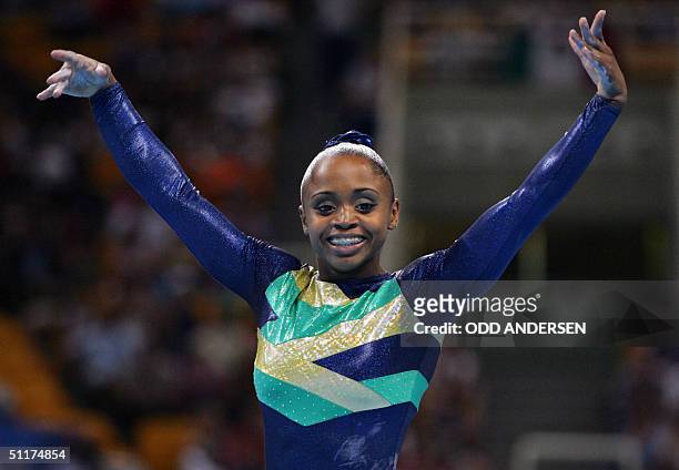 Brazil's Daiane Dos Santos performs on the floor in the women's Artistic Gymnastics qualifications, 15 August 2004 at the Olympic Indoor Hall during...