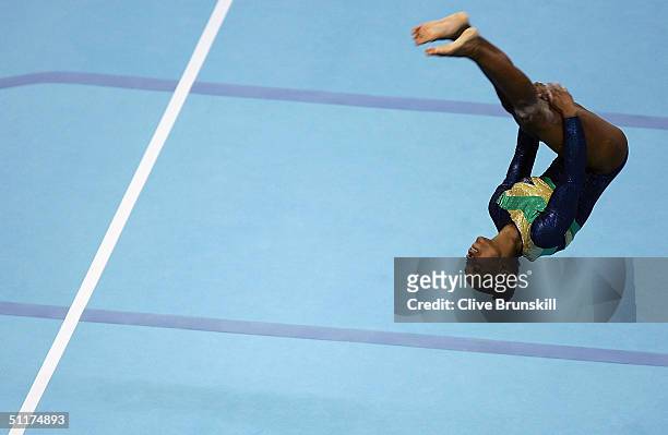 Daiane Dos Santos of Brazil competes in the floor exercise in the qualification round of the team event at the women's artistic gymnastics...