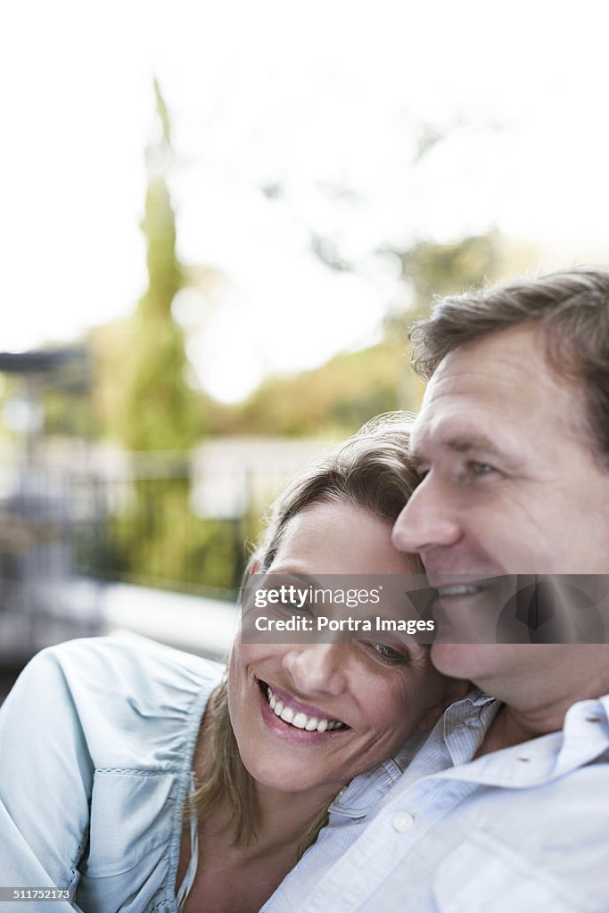 Loving couple sitting at balcony