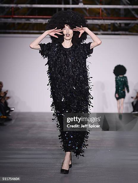 Model walks the runway at the Ashish show during London Fashion Week Autumn/Winter 2016/17 at Brewer Street Car Park on February 22, 2016 in London,...