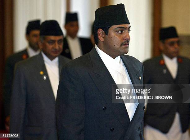 Visiting crown prince of Nepal, Paras Bir Bikram Shah Dev , leads his delegation into the Great Hall of the People in Beijing, 16 August 2004, for a...