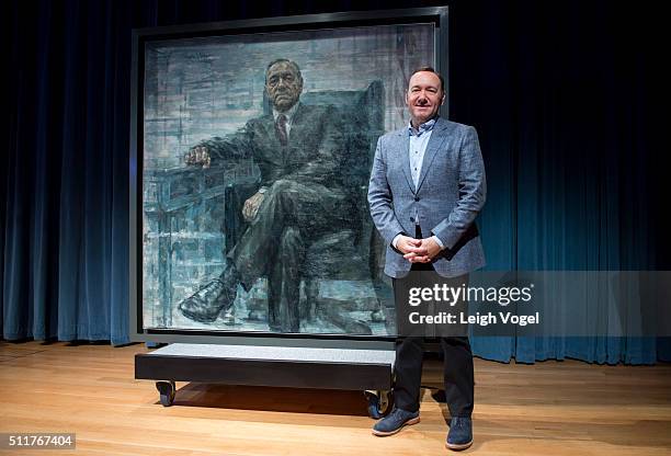 Kevin Spacey poses for a photo with a portrait of President Frank Underwood at a press conference hosted by The Smithsonian and Netflix at the...