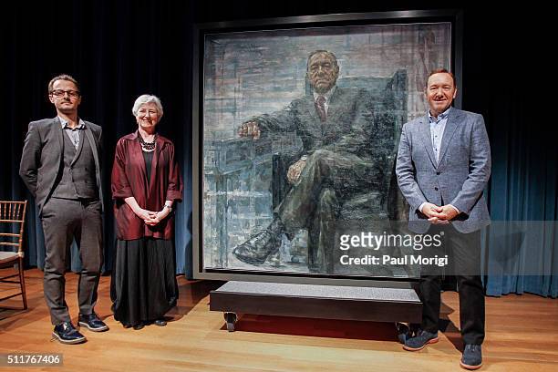 Artist Jonathan Yeo, Brandon Fortune , and Kevin Spacey pose for a photo with a portrait of President Frank Underwood at a press conference hosted by...