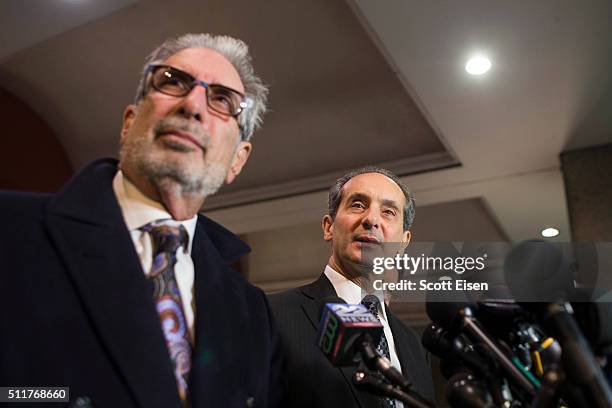 Ira Sherman listens as Joseph Cammarata, an attorney for the plaintiffs in the defamation case against comedian Bill Cosby speak to the media outside...