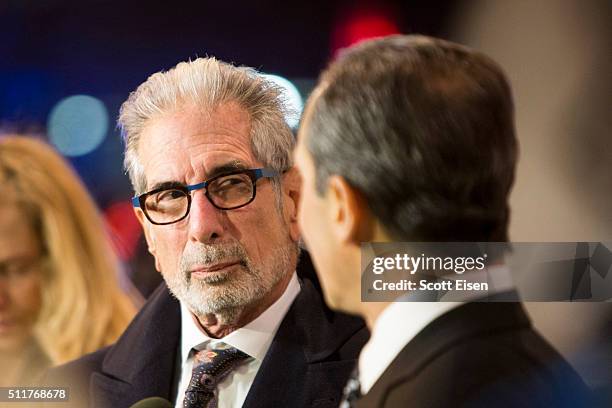 Ira Sherman listens as Joseph Cammarata, an attorney for the plaintiffs in the defamation case against comedian Bill Cosby speak to the media outside...