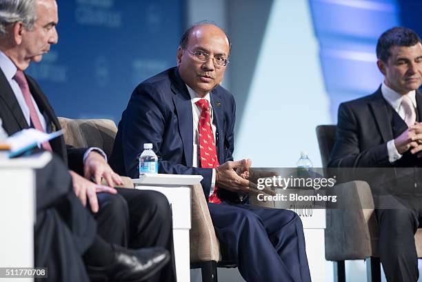 Narendra Kumar Verma, managing director of ONGC Videsh Ltd., center, speaks as John Hess, chief executive officer of Hess Corp., left, and Miguel...