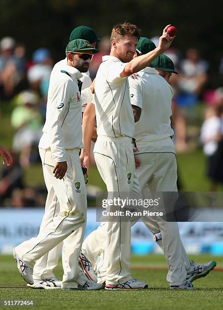 Jackson Bird of Australia raised the ball after finishing with five wickets during day four of the Test match between New Zealand and Australia at...