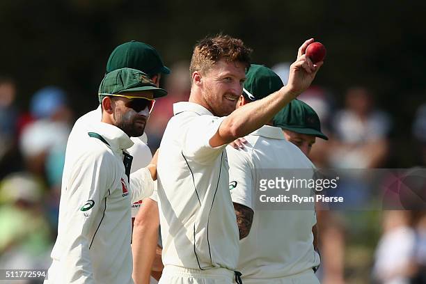 Jackson Bird of Australia raises the ball after finishing with five wickets during day four of the Test match between New Zealand and Australia at...