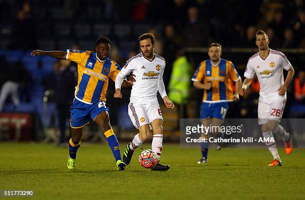 Larnell Cole of Shrewsbury Town and Juan Mata of Manchester United during the Emirates FA Cup match between Shrewsbury Town and Manchester United at...