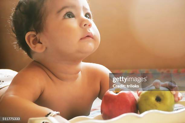 cute baby eating fruits - guayaba stock pictures, royalty-free photos & images