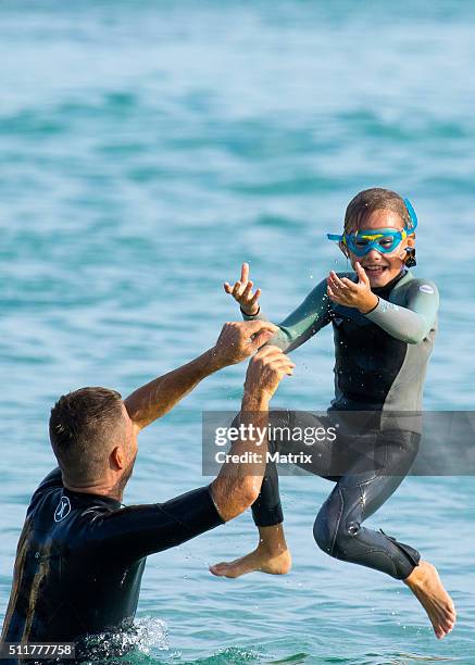 Celebrity chef, Pete Evans enjoys a surf at Bondi Beach with daughters Chilli and Indii on February 22, 2016 in Sydney, Australia.