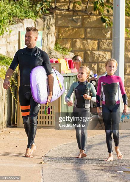 Celebrity chef, Pete Evans enjoys a surf at Bondi Beach with daughters Chilli and Indii on February 22, 2016 in Sydney, Australia.